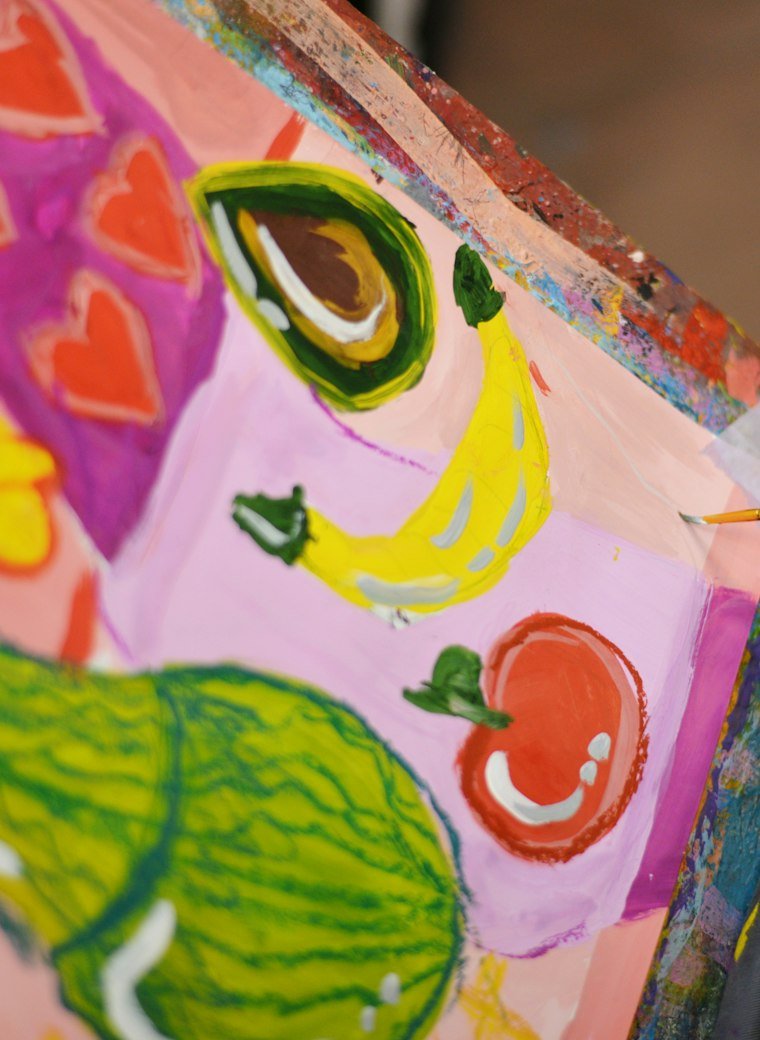 A child's colourful painting on canvas