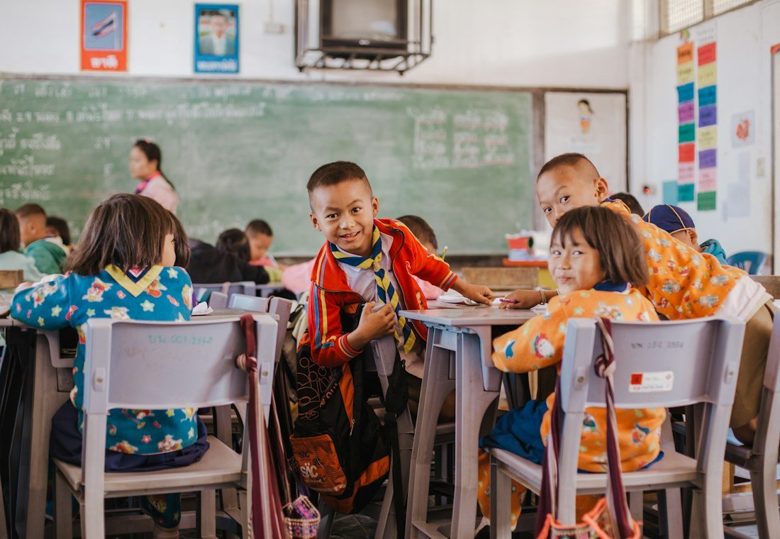 Children working at desks in a classroom