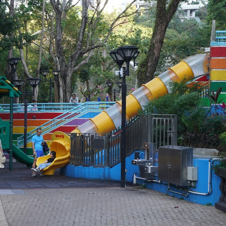 A playground with colourful slides and climbing equipment