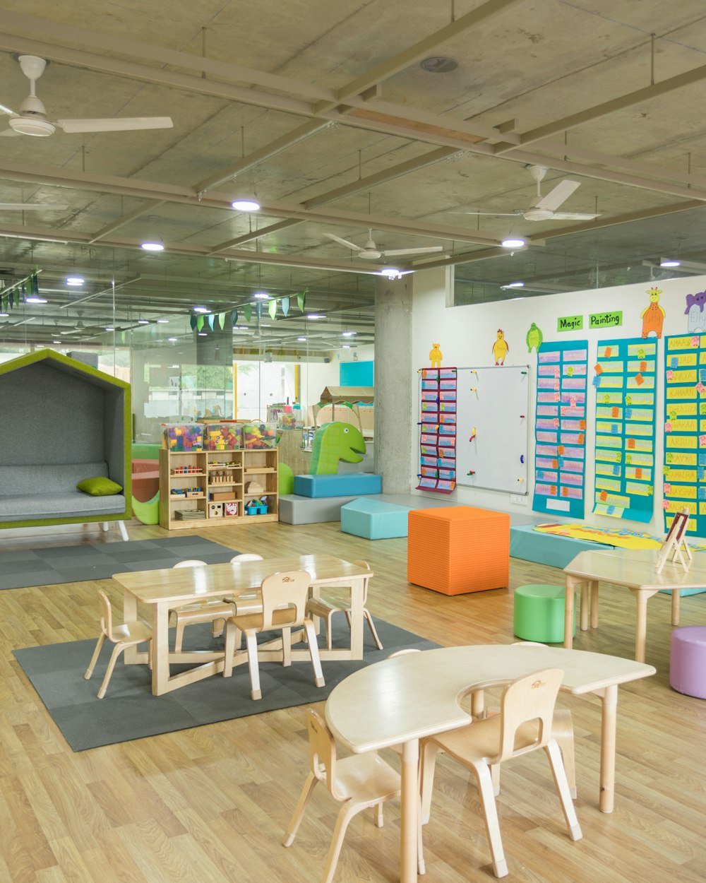 A bright, modern nursery room with child-height furniture and storage